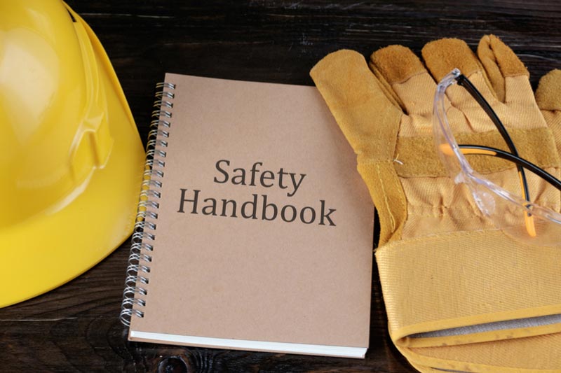 safety PPE equipment placed on a wooden bench